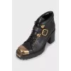 Black boots with gold toe