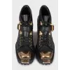 Black boots with gold toe
