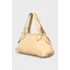 Beige bag with gold hardware