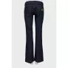 Flared jeans decorated with chain