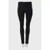 Black trousers with silver zippers