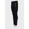 Black trousers with silver zippers