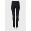 Black trousers with silver zippers