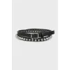 Leather belt decorated with studs