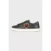 Black leather sneakers with decor
