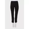 Black leggings decorated with stripes