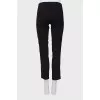 Black leggings decorated with stripes