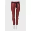 Red trousers with a belt