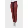 Red trousers with a belt