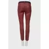 Red trousers with a belt