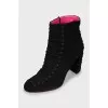 Suede ankle boots decorated with laces