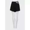 Tweed short skirt with brooch