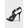Black sandals with embossed leather