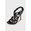 Black sandals with embossed leather