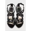 Black sandals with embossed leather