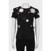 Black T-shirt decorated with flowers