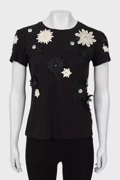 Black T-shirt decorated with flowers