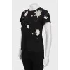 Black T-shirt decorated with flowers