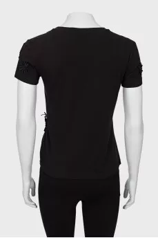 Black T-shirt decorated with flowers