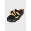 Leather mules decorated with chain