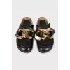 Leather mules decorated with chain