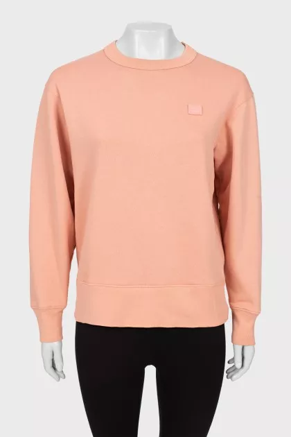 Pink sweatshirt with brand logo