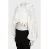 Lace blouse with voluminous sleeves