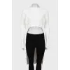 White sweater elongated at the back