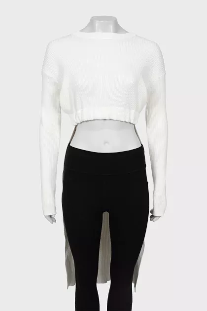 White sweater elongated at the back