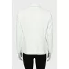 Fitted jacket with zippers on the sleeves