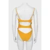Yellow swimsuit with tag