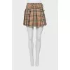Pleated wool miniskirt