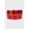 Patent leather belt with signature embossing