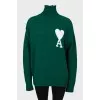 Knitted green wool sweater