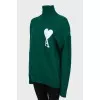 Knitted green wool sweater