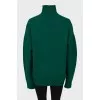 Knitted green wool sweater