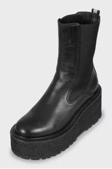 Leather boots with a massive wedge heel