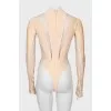 Beige bodysuit with transparent inserts