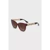 Sunglasses with red frames