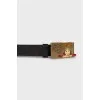 Men's leather belt with a pattern on the buckle