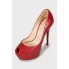 Red shoes with embossed leather