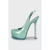 Open heel patent leather shoes