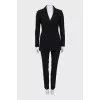 Suit with black trousers