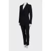 Suit with black trousers