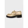 Gold leather loafers