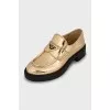Gold leather loafers