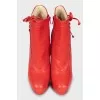 Red ankle boots with perforations