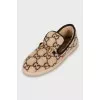 Fur moccasins with signature print