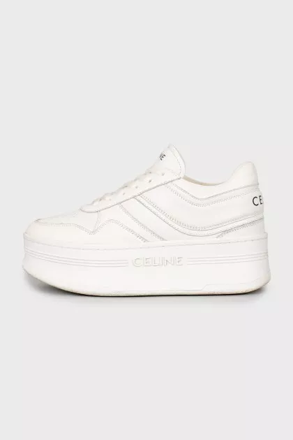 White high-heeled sneakers
