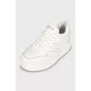 White high-heeled sneakers